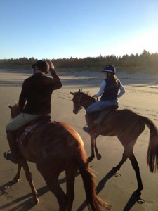 On the beach: enjoying a ride with Rachael Alder.